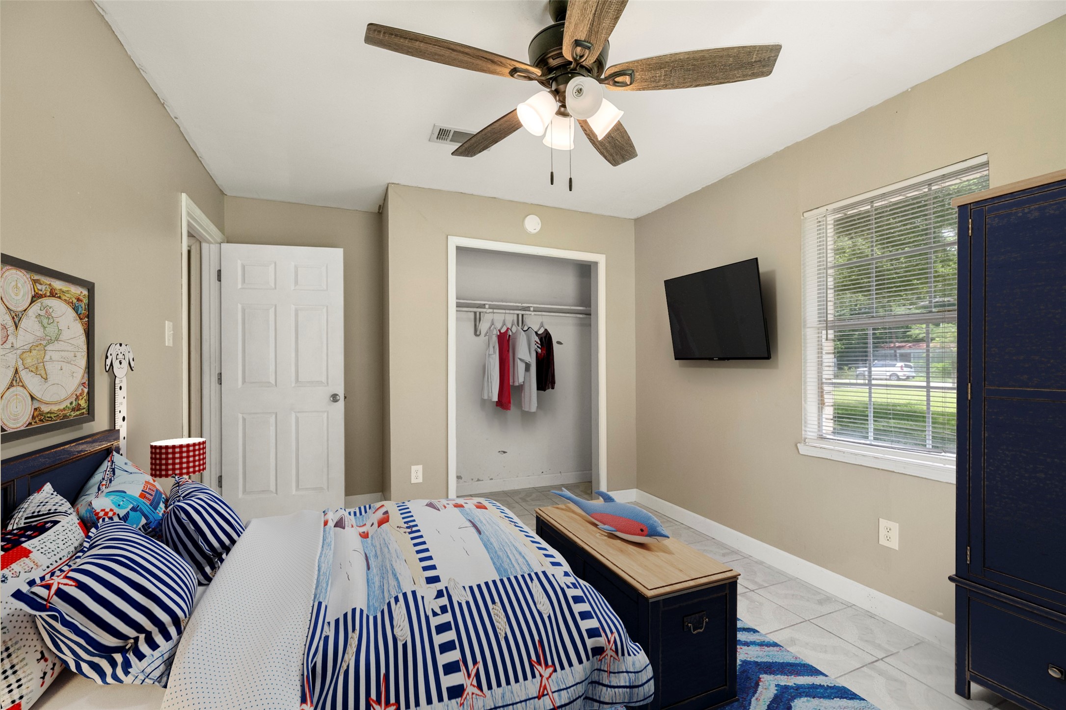 140 Friar Tuck Road Shepherd, TX 77371 - Photo 18 of 36 a bedroom with bed and a flat screen tv