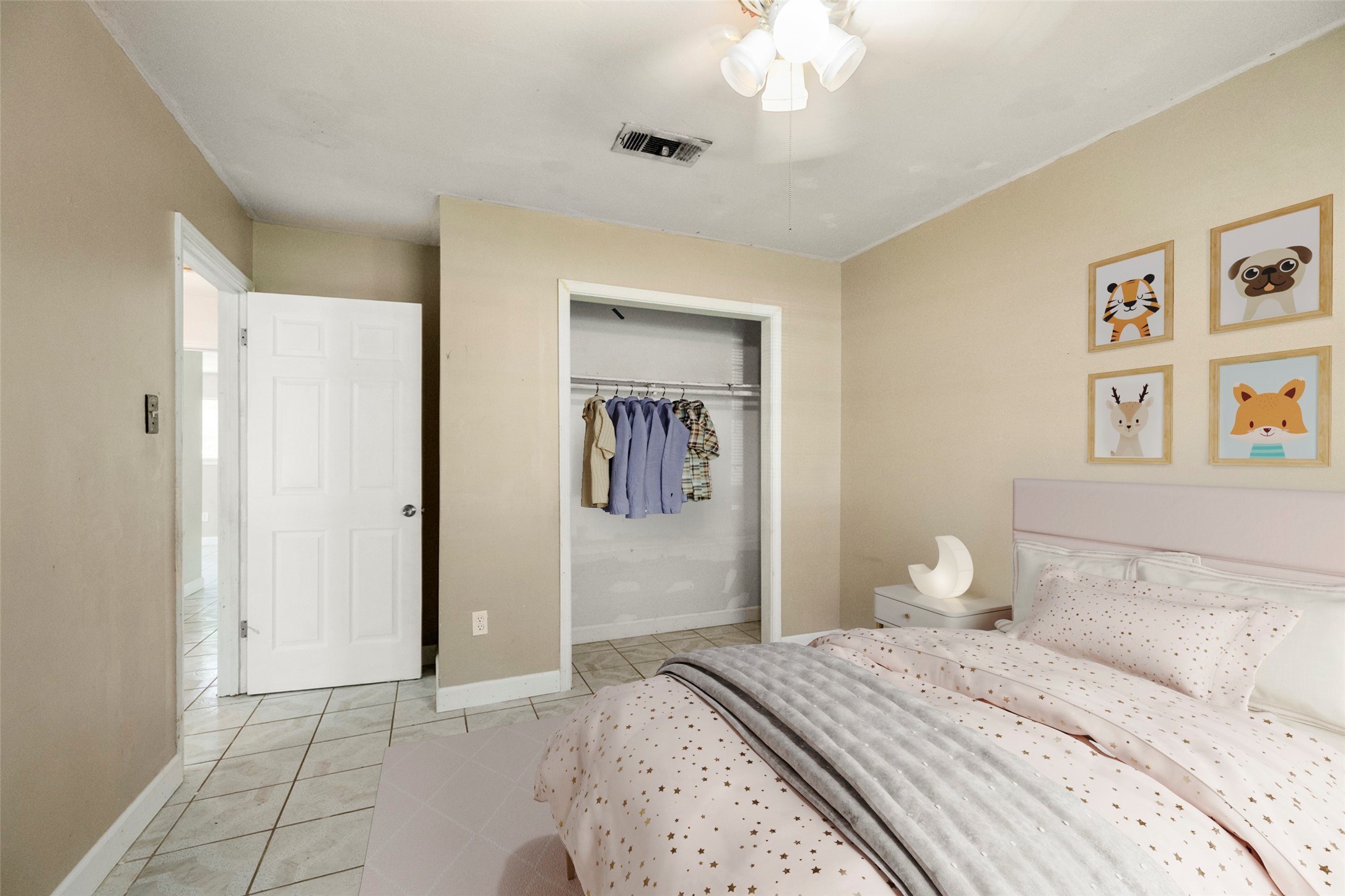 140 Friar Tuck Road Shepherd, TX 77371 - Photo 23 of 36 a bedroom with a large bed a chandelier and closet