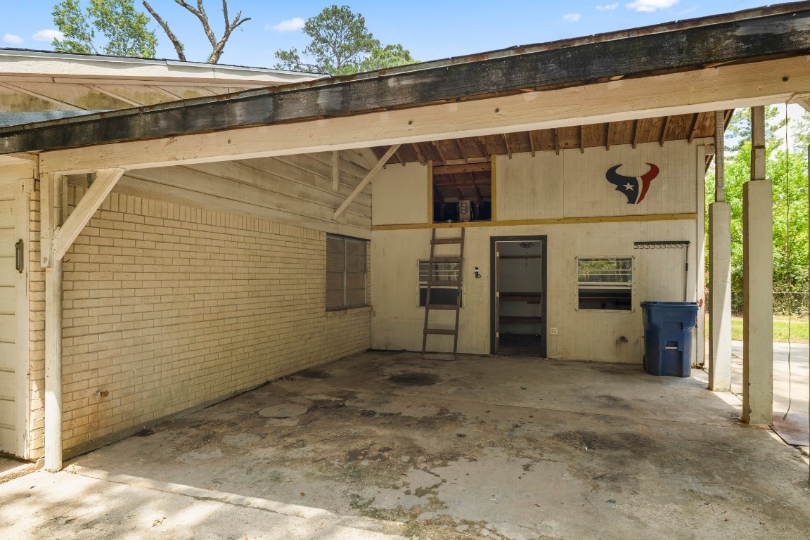 140 Friar Tuck Road Shepherd, TX 77371 - Photo 26 of 36 a view of a car garage door