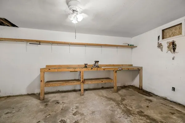a view of room with racks and exposed radiator