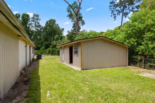 a view of an empty room with wooden walls