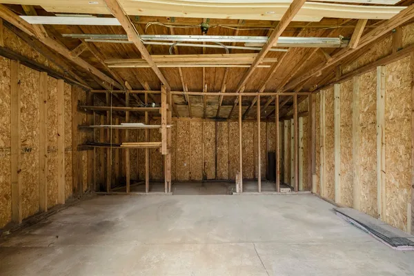 a view of an empty room with wooden walls