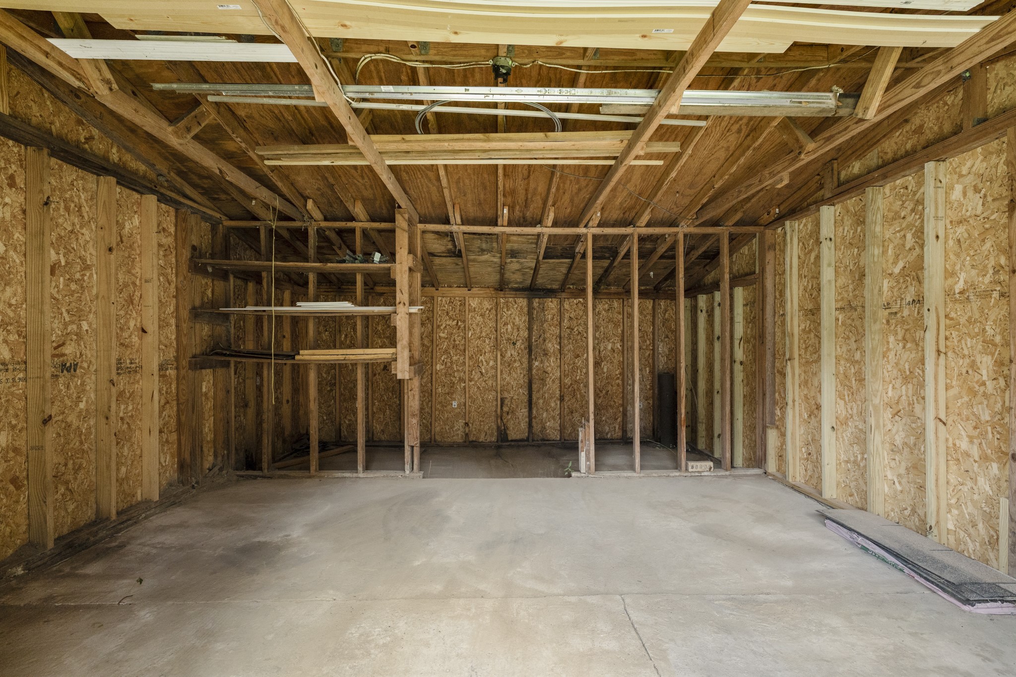140 Friar Tuck Road Shepherd, TX 77371 - Photo 33 of 36 a view of an empty room with wooden walls