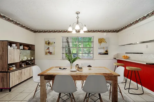 a view of a dining room with furniture window and outside view