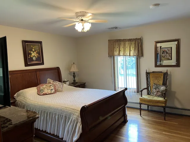 a bedroom with a bed and a table