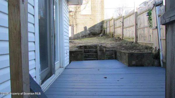 a view of a wooden door of a house
