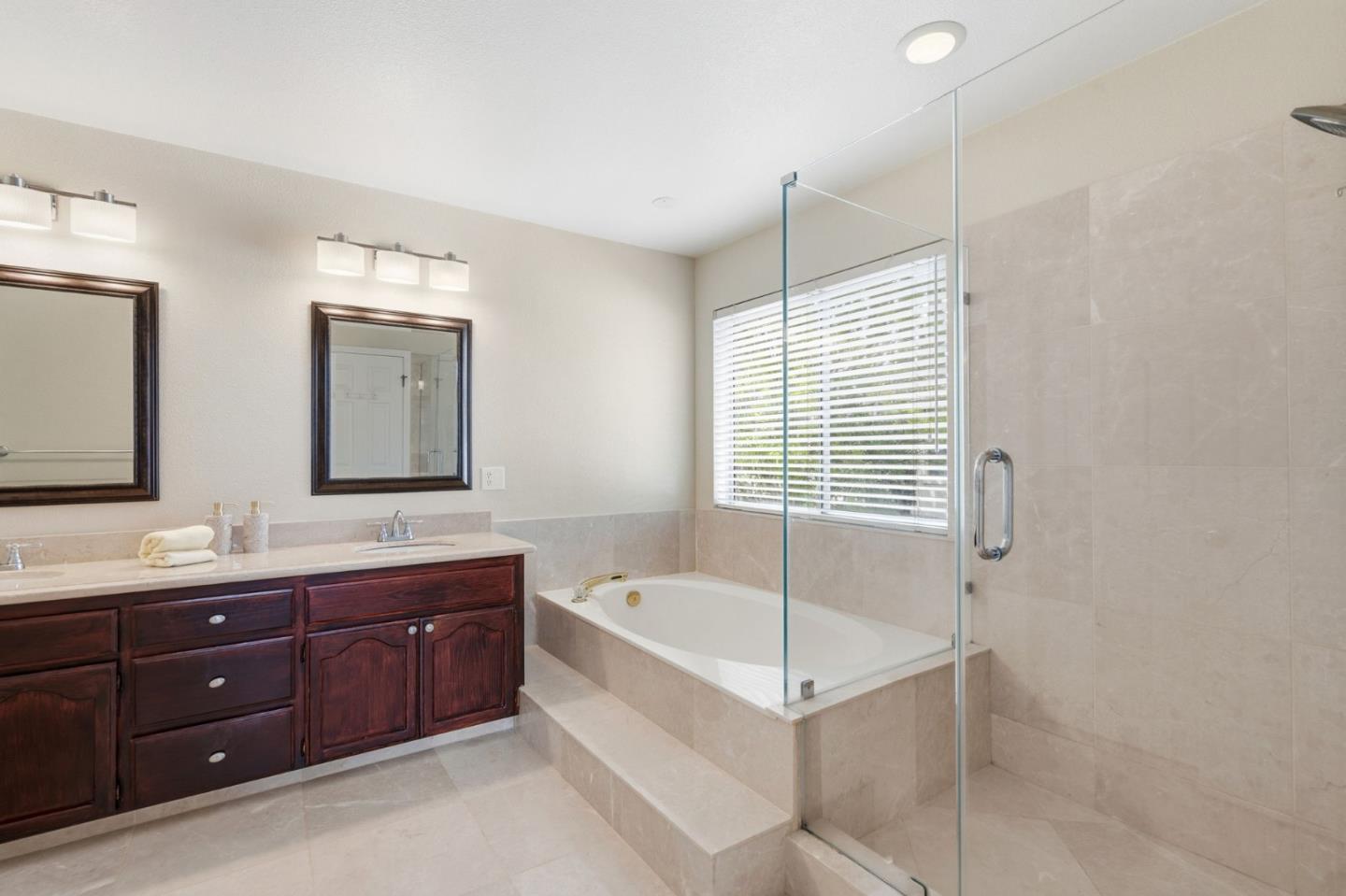35 Sierra Ridge Court Danville, CA 94506 - Photo 23 of 37 a spacious bathroom with a tub sink shower and mirror