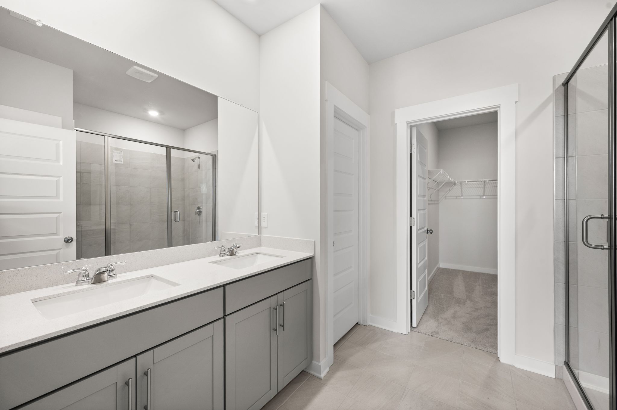 1019 Curtis Spring Lane Lewisburg, TN 37091 - Photo 14 of 23 a bathroom with a double vanity sink and mirror
