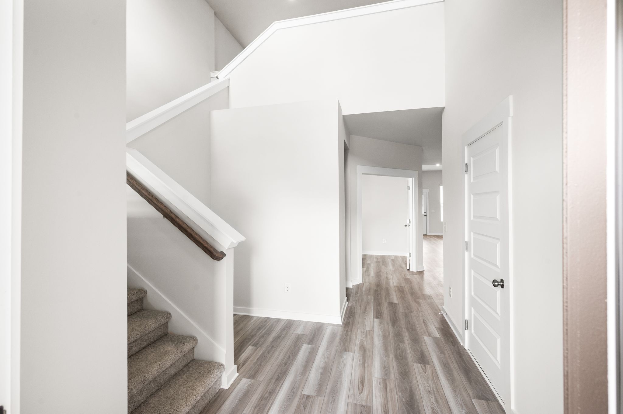 1019 Curtis Spring Lane Lewisburg, TN 37091 - Photo 3 of 23 a view of a hallway with wooden floor and staircase
