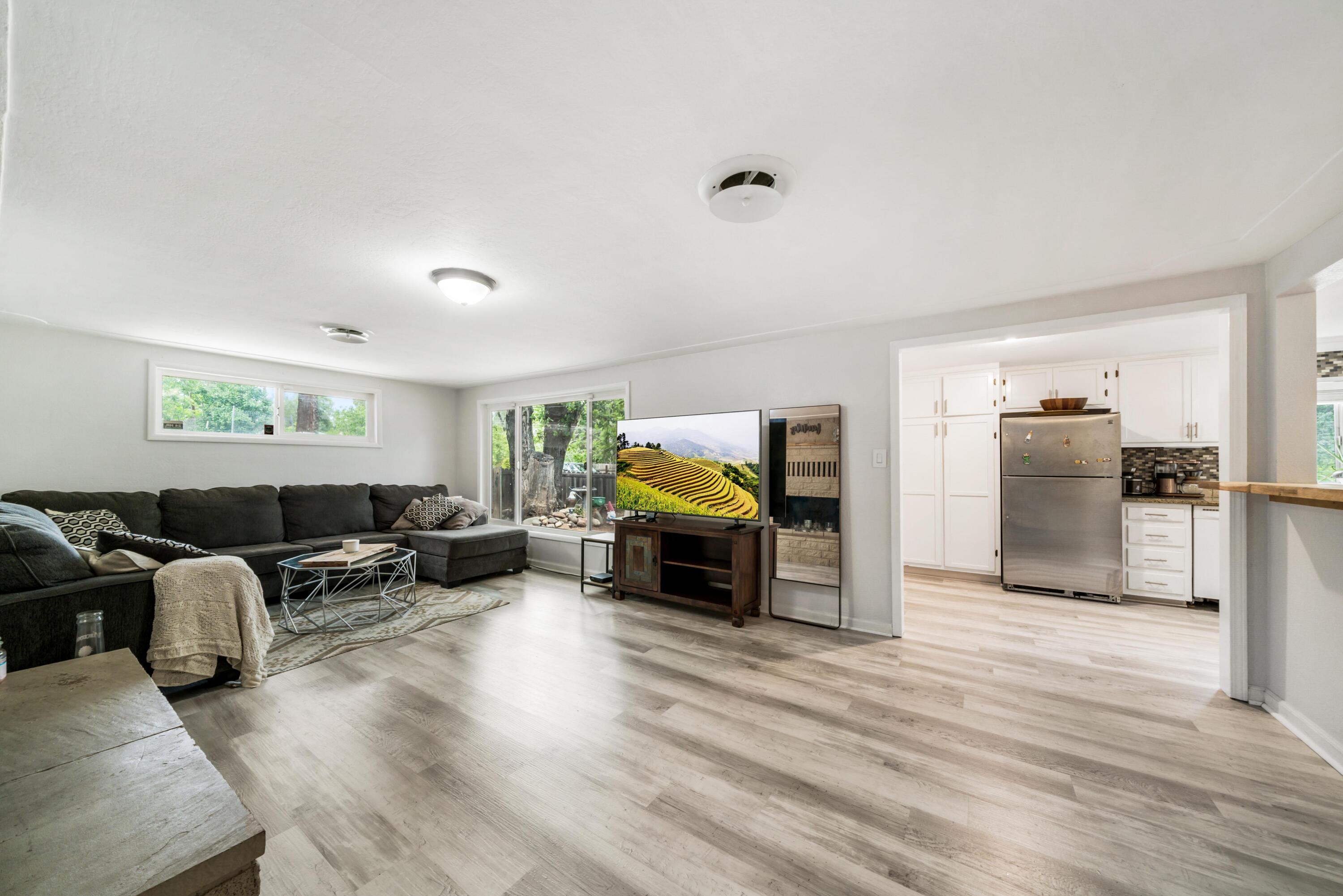 3113 Quartz Hill Road Redding, CA 96003 - Photo 4 of 36 a living room with furniture fireplace and wooden floor