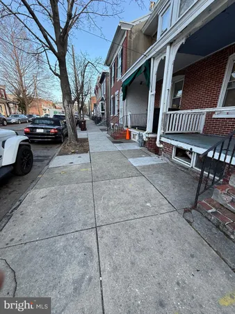 a view of street with parked cars
