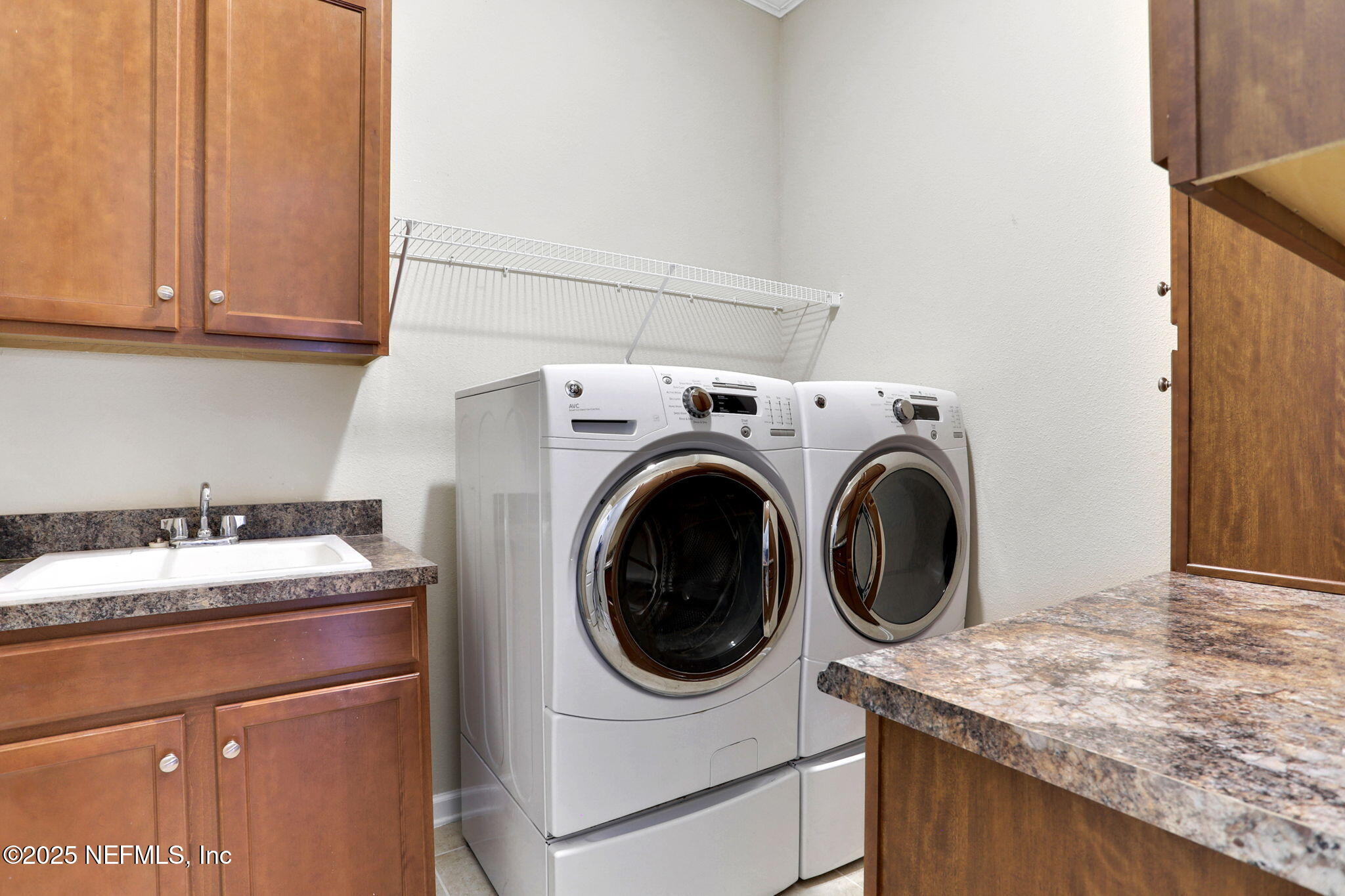 4484 Gray Hawk Street Orange Park, FL 32065 - Photo 62 of 103 Laundry room with sink and cabinets