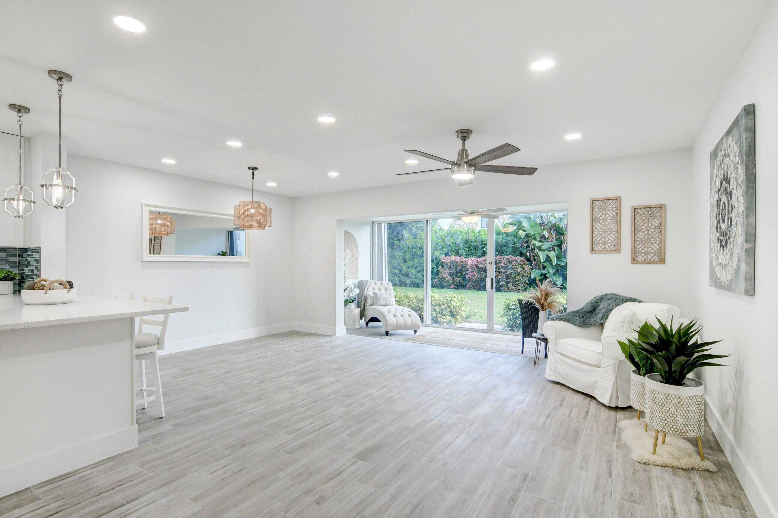 5720 Old Ocean Boulevard, Unit 4W Ocean Ridge, FL 33435 - Photo 13 of 46 a living room with furniture floor to ceiling window and wooden floor