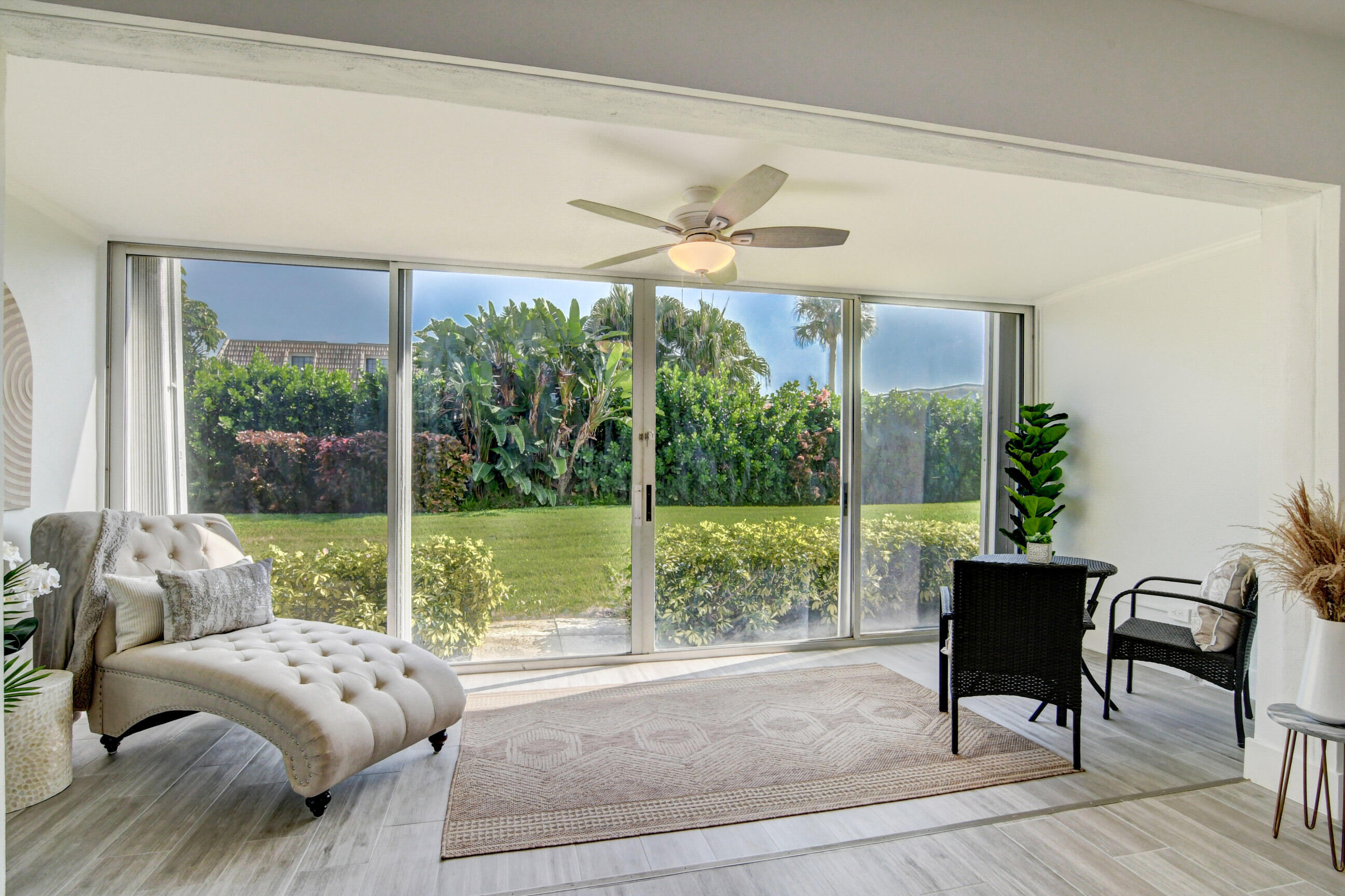 5720 Old Ocean Boulevard, Unit 4W Ocean Ridge, FL 33435 - Photo 23 of 46 a living room with furniture and a large window