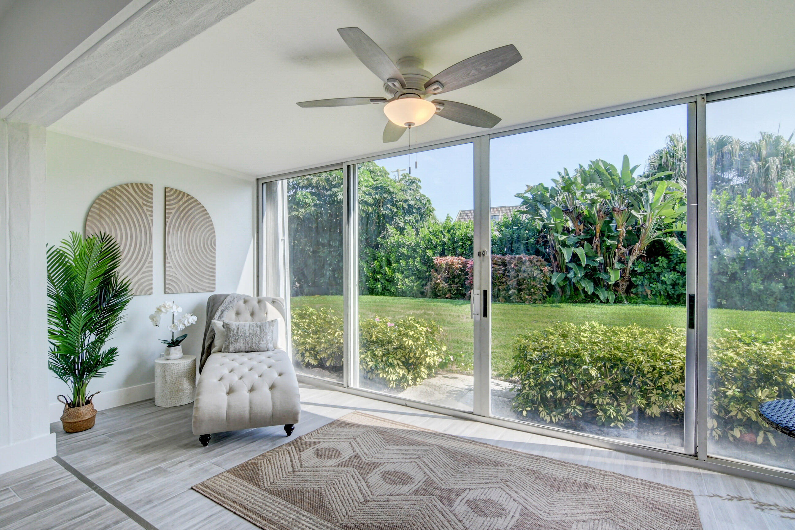 5720 Old Ocean Boulevard, Unit 4W Ocean Ridge, FL 33435 - Photo 24 of 46 a living room with furniture and a large window