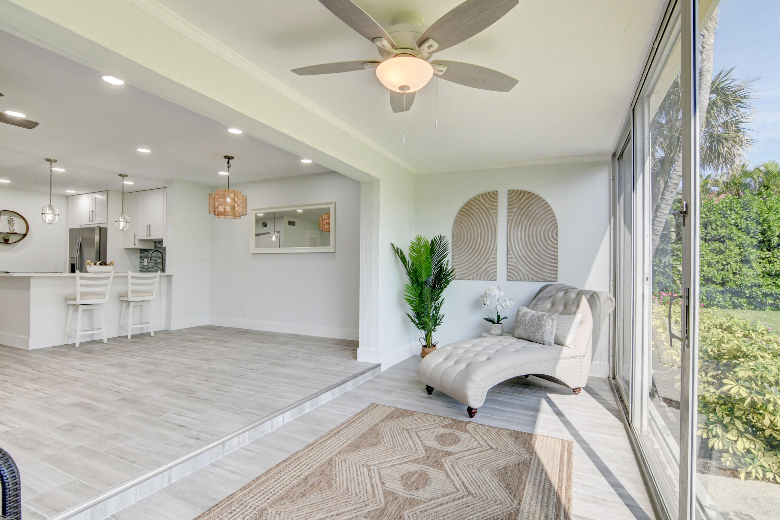 5720 Old Ocean Boulevard, Unit 4W Ocean Ridge, FL 33435 - Photo 25 of 46 a living room with furniture and a large window