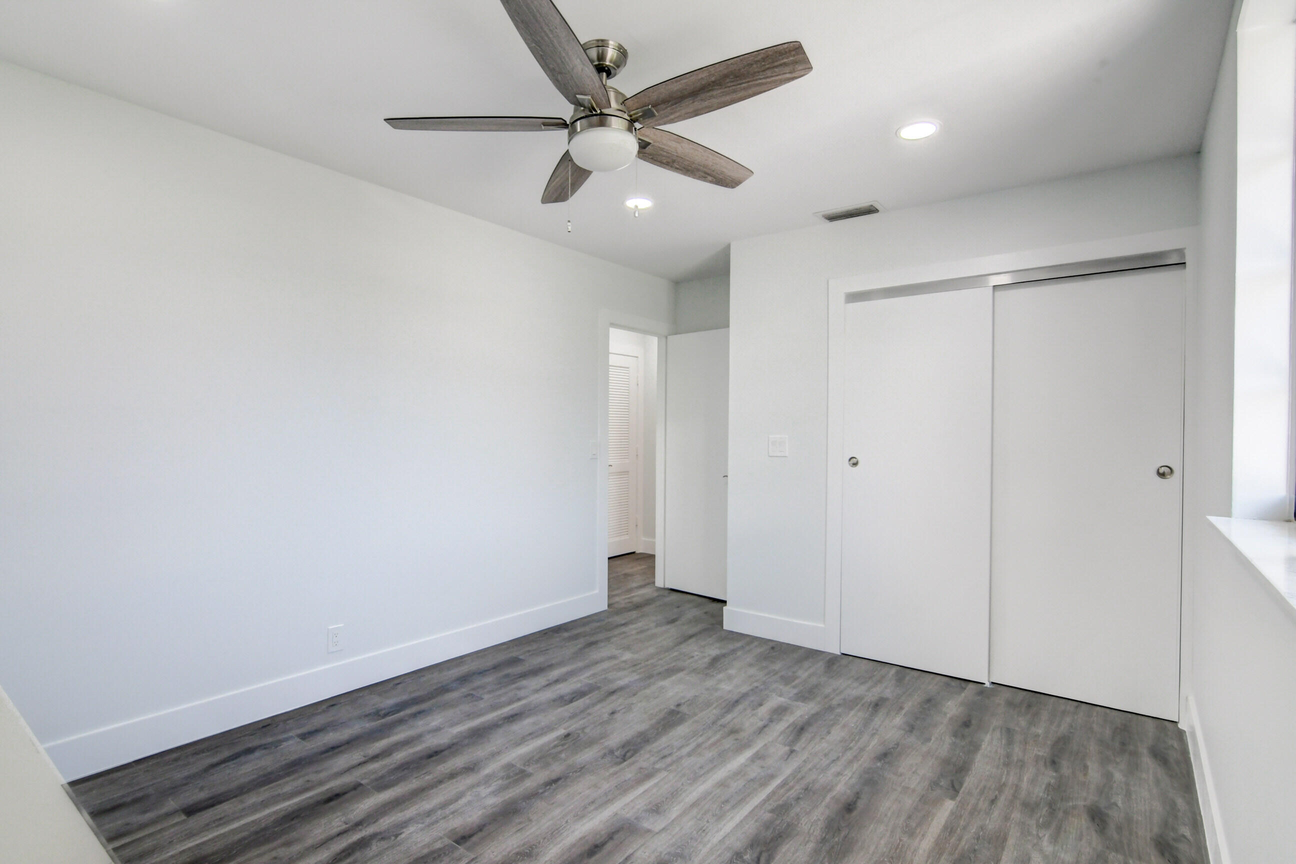 5720 Old Ocean Boulevard, Unit 4W Ocean Ridge, FL 33435 - Photo 35 of 46 wooden floor in an empty room