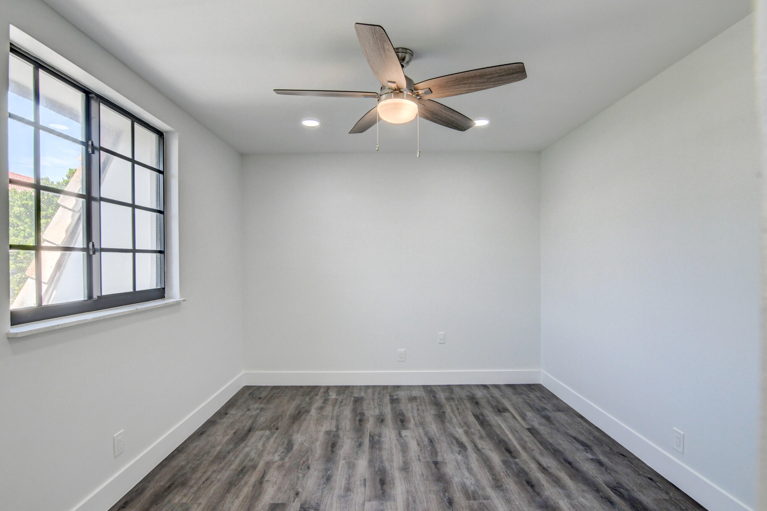 5720 Old Ocean Boulevard, Unit 4W Ocean Ridge, FL 33435 - Photo 37 of 46 wooden floor in an empty room with a window