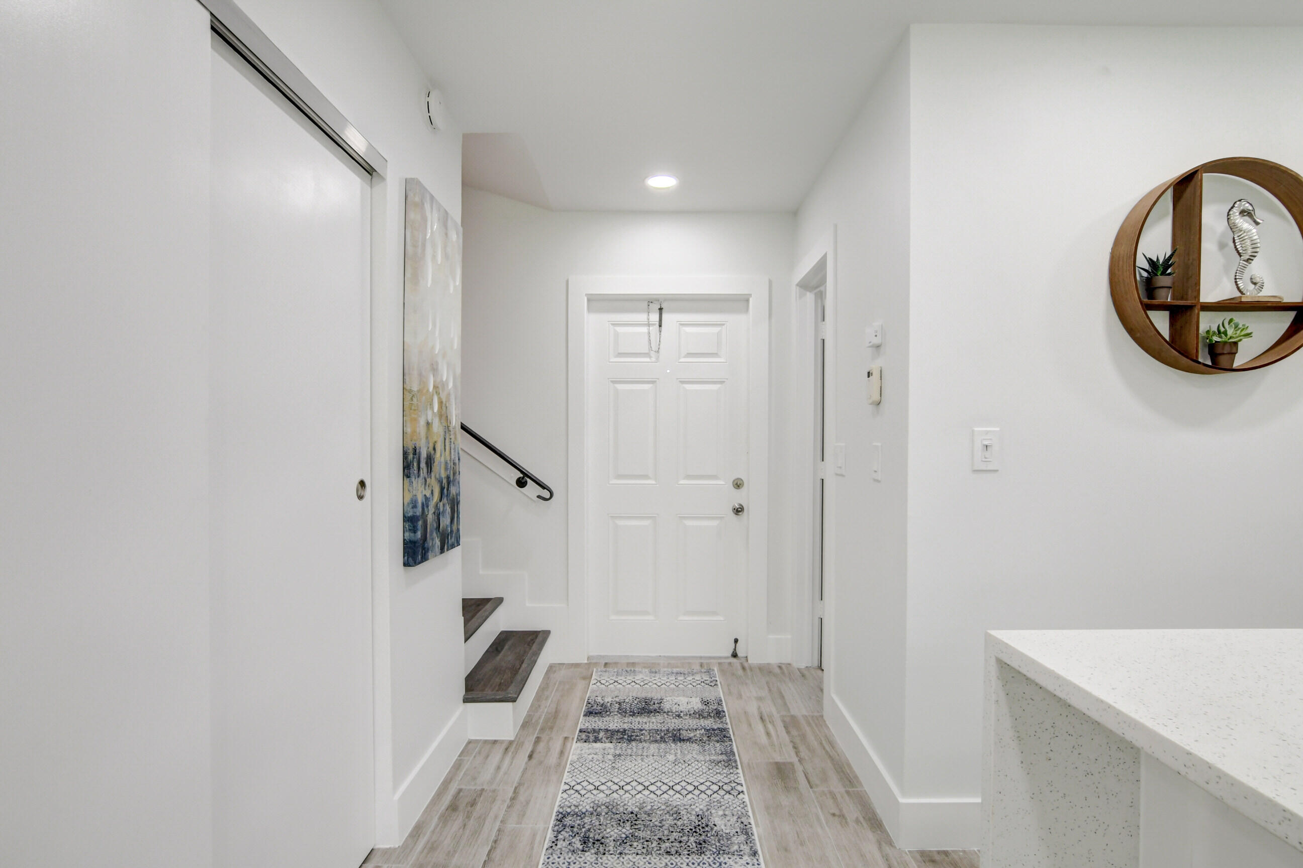 5720 Old Ocean Boulevard, Unit 4W Ocean Ridge, FL 33435 - Photo 9 of 46 a view of a hallway with entryway