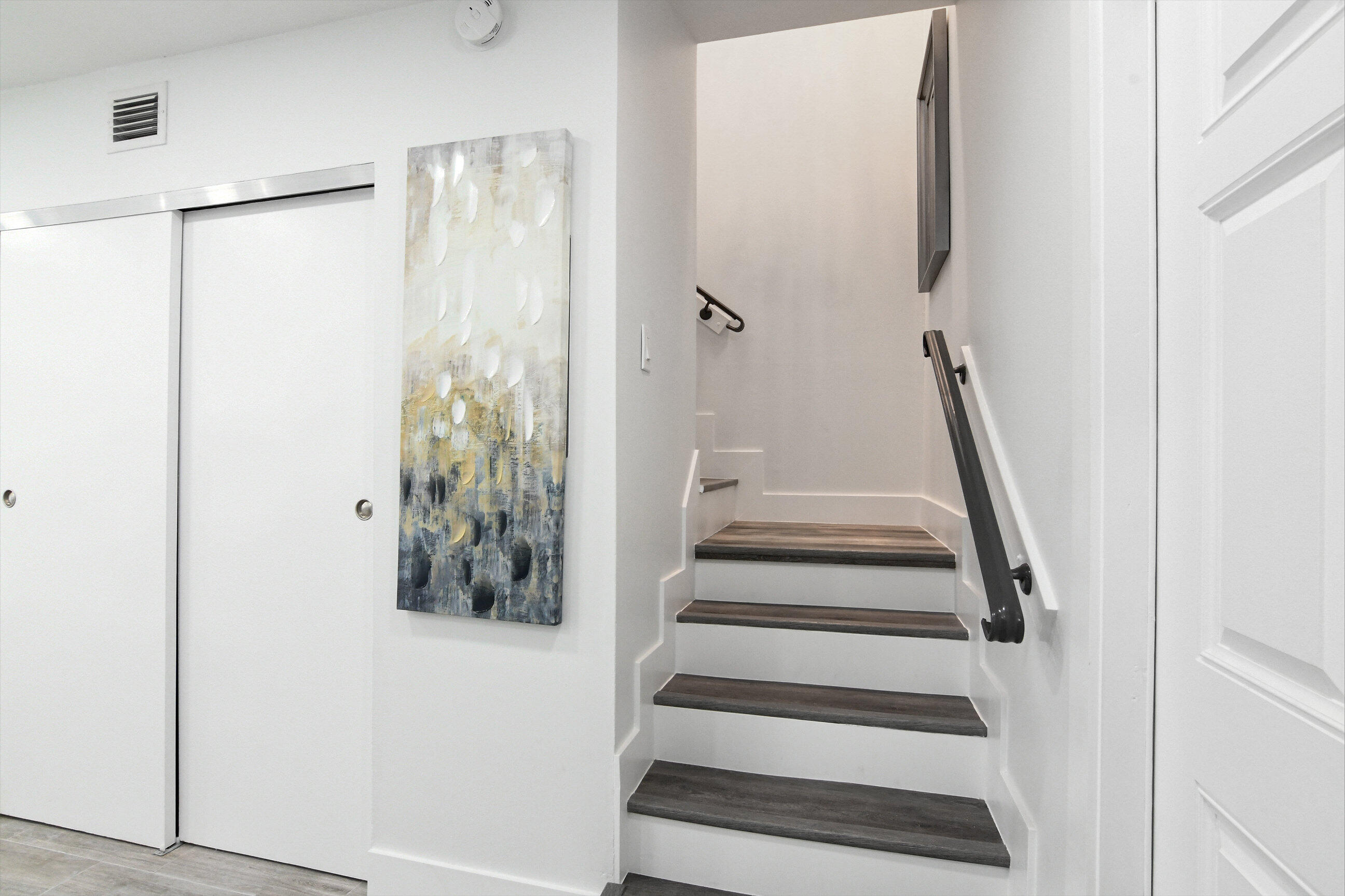 5720 Old Ocean Boulevard, Unit 4W Ocean Ridge, FL 33435 - Photo 10 of 46 a view of staircase with white walls