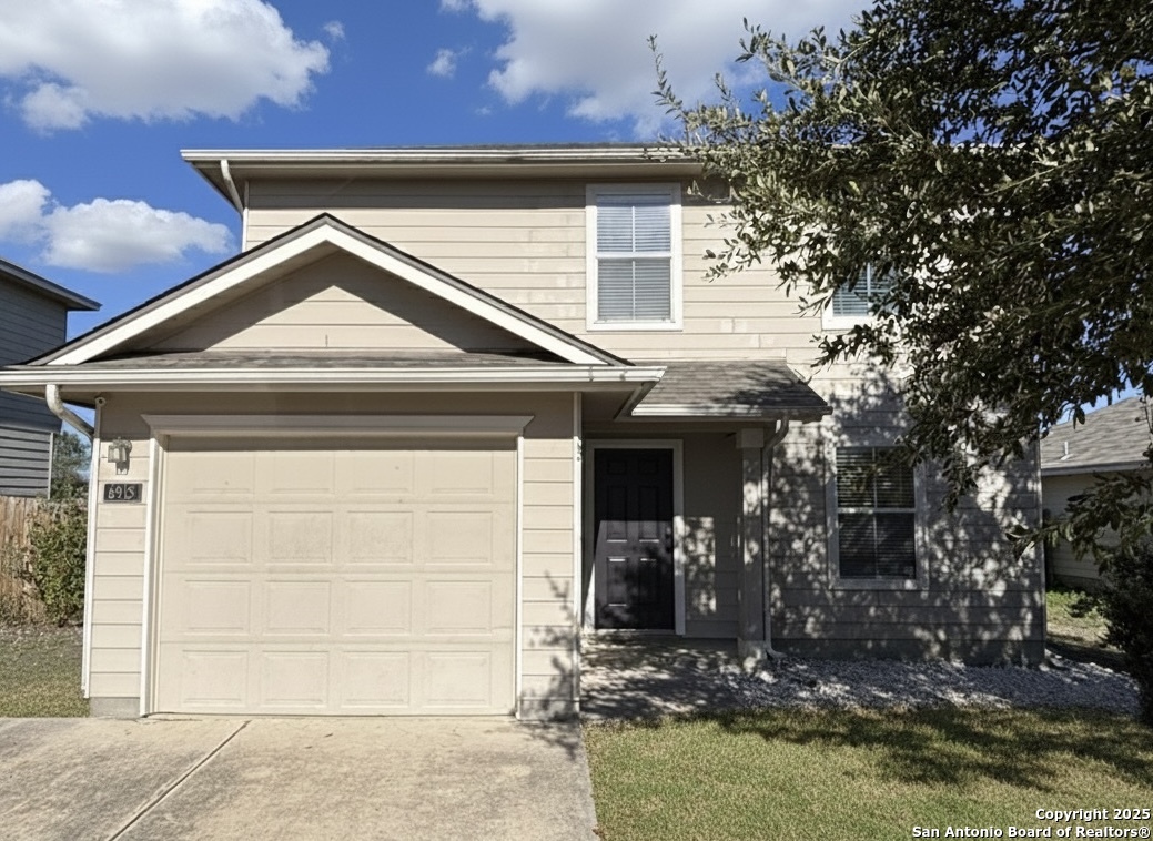 a front view of a house with a garage