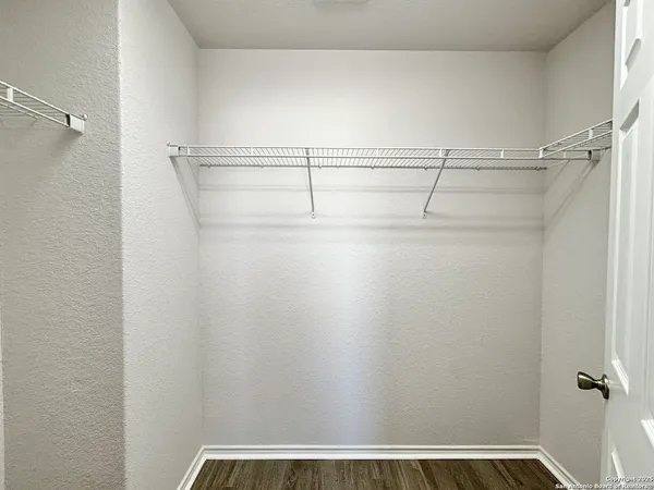 a view of a room with racks on the wall