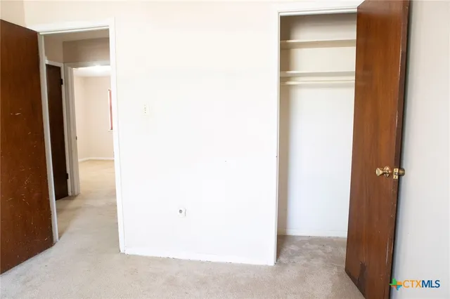 a view of a room with a wardrobe space
