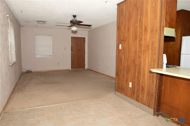 an empty room with a bathroom