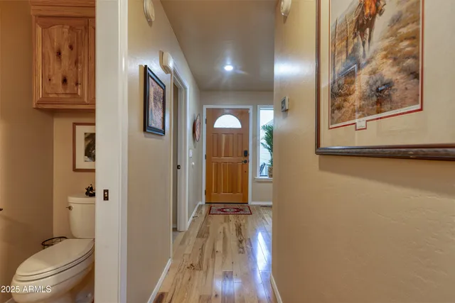 a bathroom with a sink a toilet and a shower