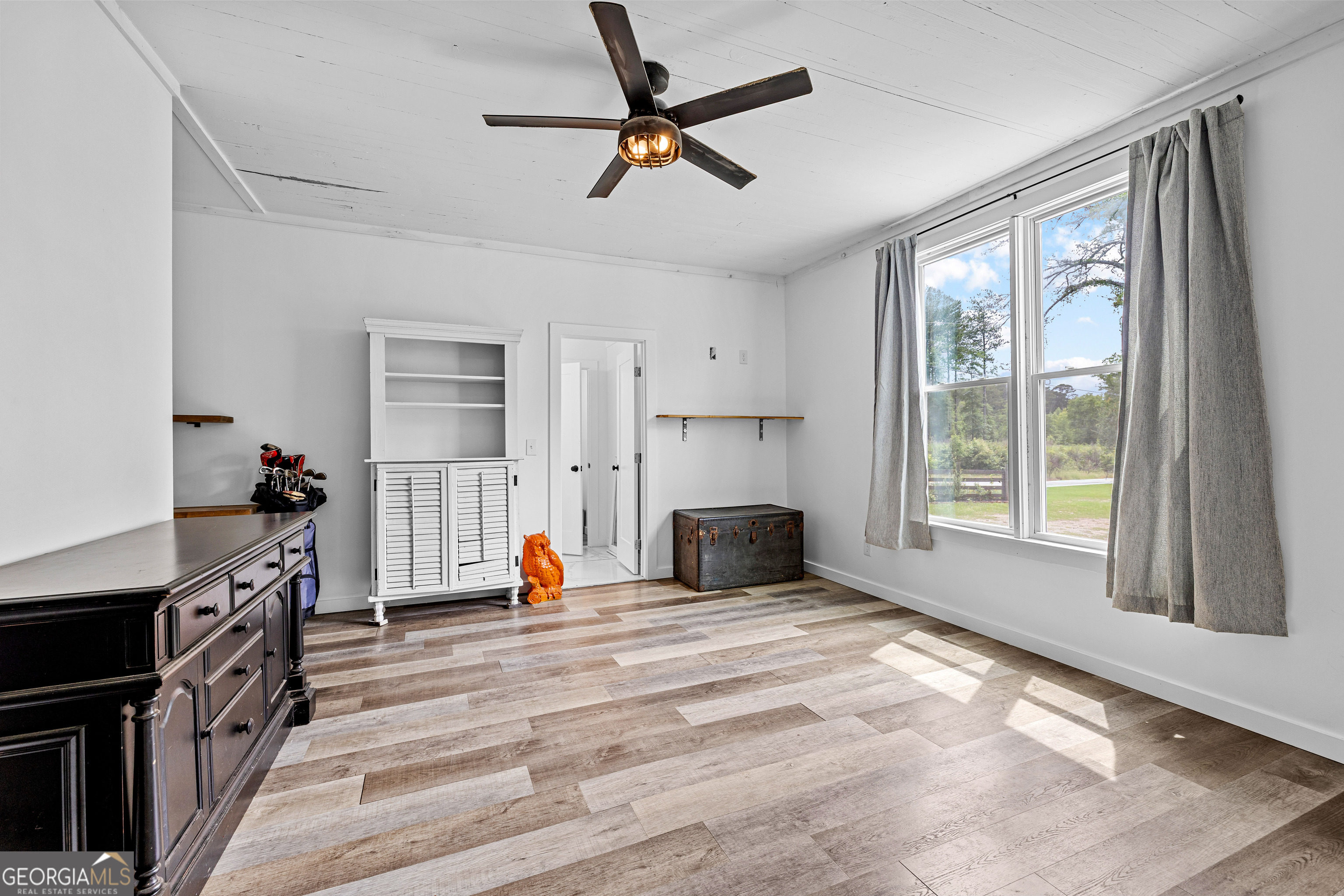 1329 Standing Rock Road Senoia, GA 30276 - Photo 32 of 77 a view of a livingroom with furniture and a ceiling fan
