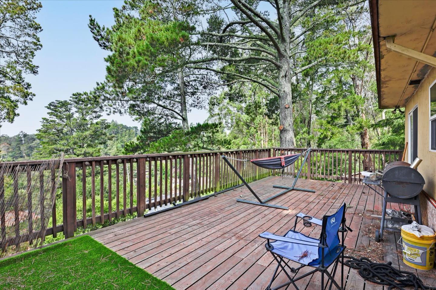 6821 Ridgewood Drive Oakland, CA 94611 - Photo 15 of 26 a view of a deck with chairs and wooden floor