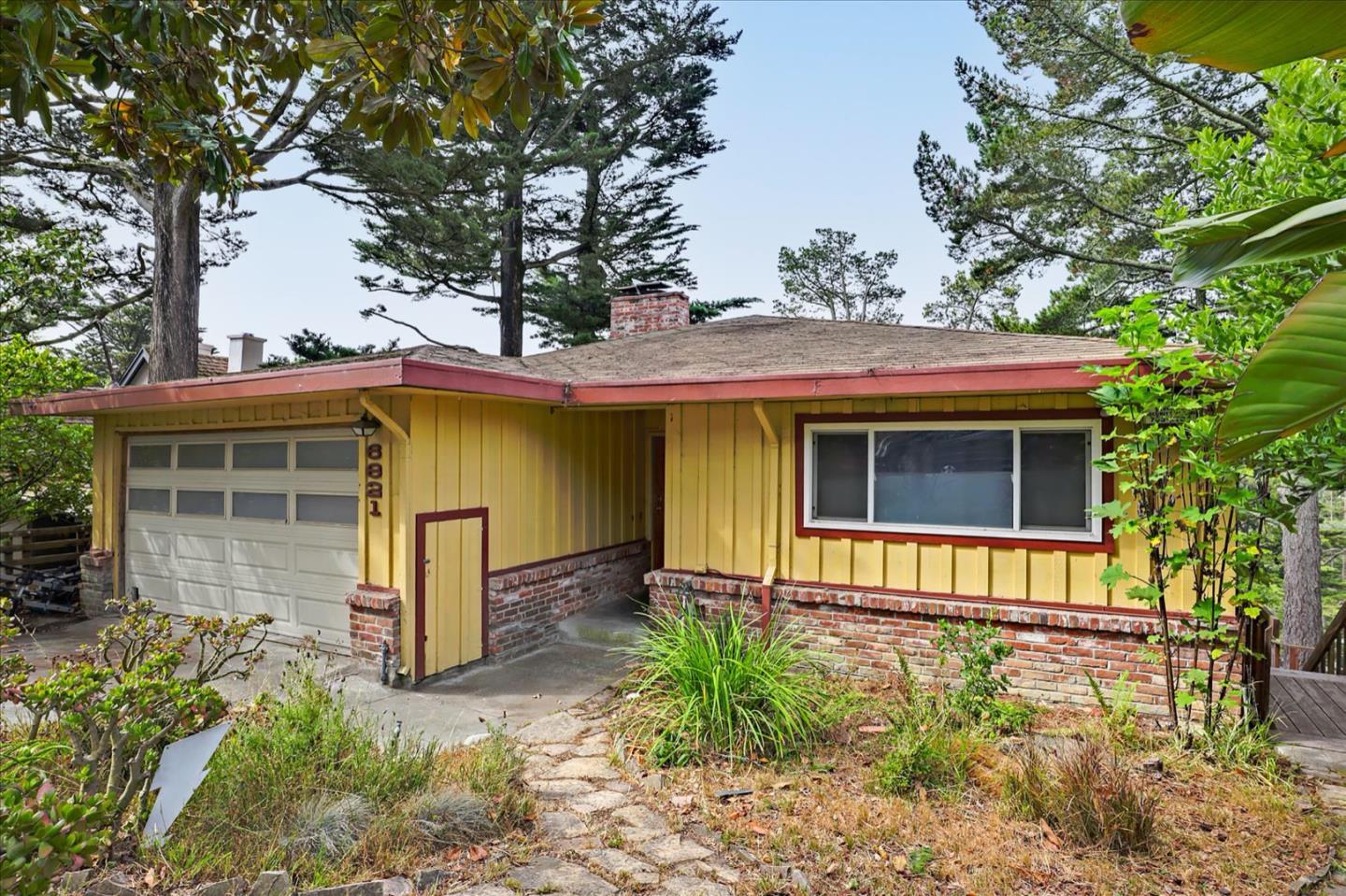 6821 Ridgewood Drive Oakland, CA 94611 - Photo 3 of 26 a front view of a house with garden