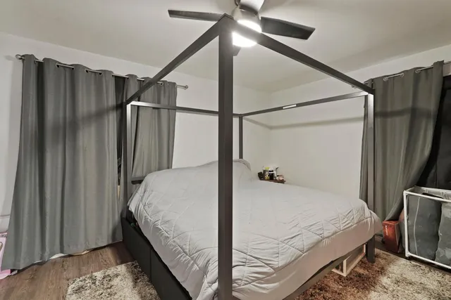 a bedroom with a bed window and a walk in closet