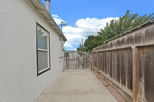 a view of a wooden door with a backyard
