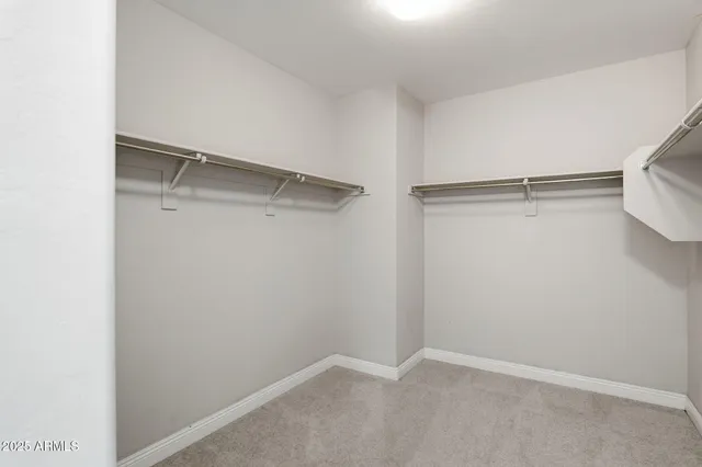 a view of an empty walk in closet