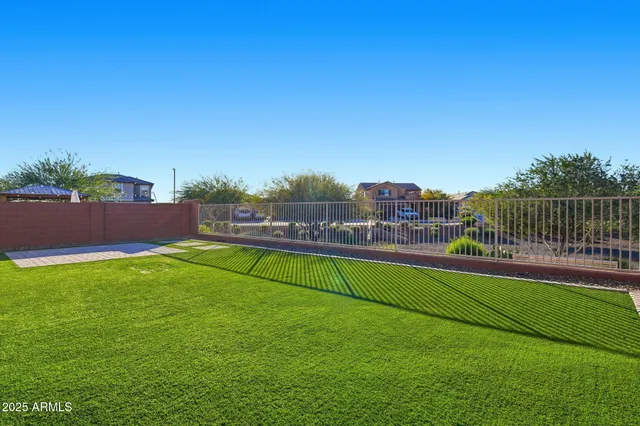 a view of a deck with a big yard