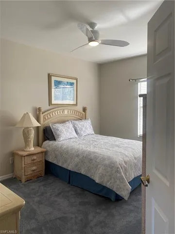 a bedroom with bed and window