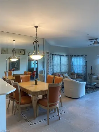 a dining room with a table and chairs