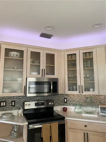 a kitchen with a stove and a sink