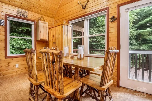 a view of a chairs and table in the balcony