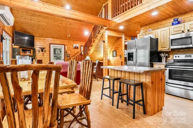 a view of a chairs and table in the balcony