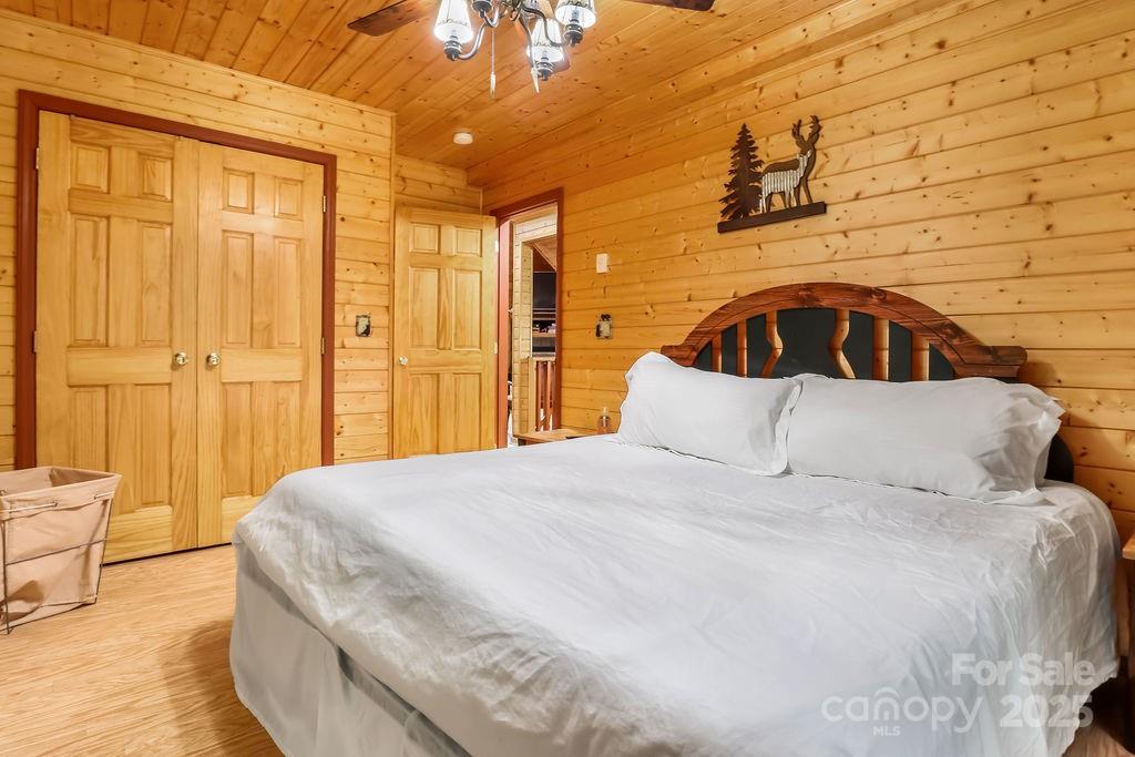 4271 Old Field Creek Road Grassy Creek, NC 28631 - Photo 17 of 27 a bedroom with a bed and a cabinets