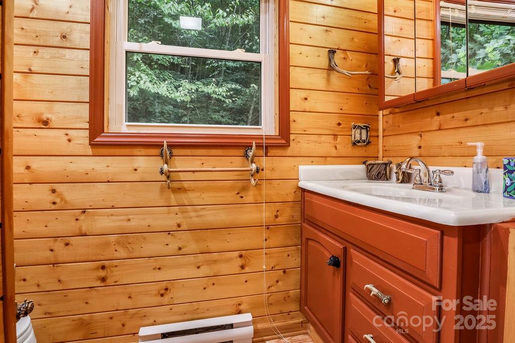 4271 Old Field Creek Road Grassy Creek, NC 28631 - Photo 21 of 27 a bathroom with a sink and a window