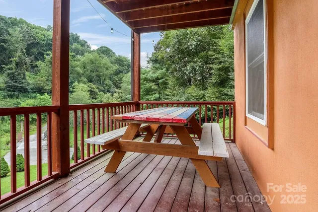 a view of a two chairs in the balcony