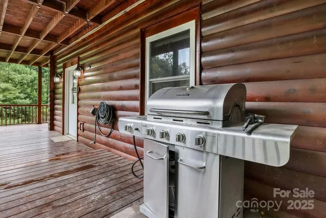 a kitchen with stainless steel appliances granite countertop a stove a sink and a wooden floors