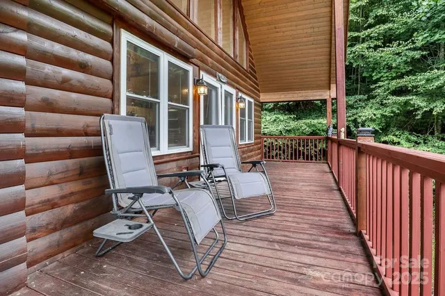 a view of deck with chairs and wooden floor