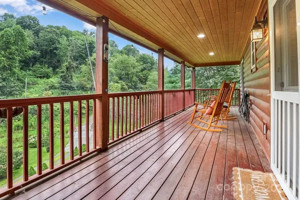 a view of balcony with wooden floor