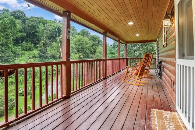 a view of balcony with wooden floor
