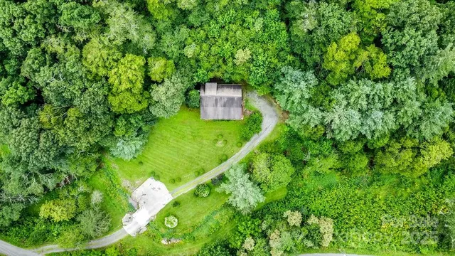 a backyard of a house with a yard and green space