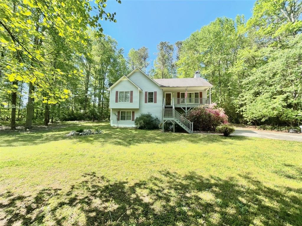 10 Misty Ridge Point Hiram, GA 30141 - Photo 1 of 1 a view of a house with a yard and swimming pool